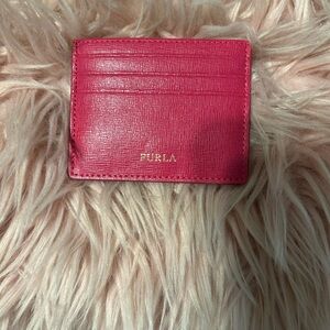 It’s a FURLA CAMELIA CARD CASE S. Pink. NWOT